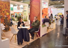 Rely Jaldety of Jaldety talking with a visitor.